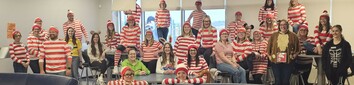 SPS Staff dressed as Where's Waldo and in costumes for halloween